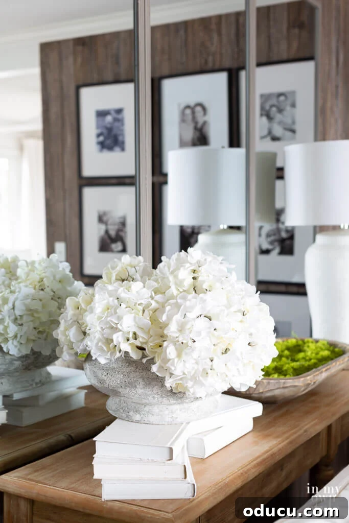 Grand Living Room on a Small Budget: $240 Makeover 9 Expert tips on how to effectively use mirrors to make any room look larger and more inviting.