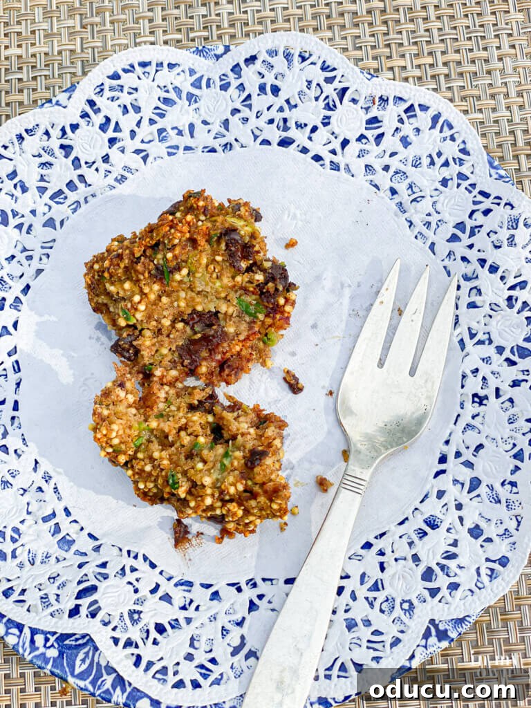 Guilt free chocolate chip zucchini muffins on a plate. How to make whole food, plant based zucchini muffins that have no oil, eggs or dairy. But they do have one ingredient you may not expect. It is what makes the muffin recipe taste so good. They are guilt free and freeze well.