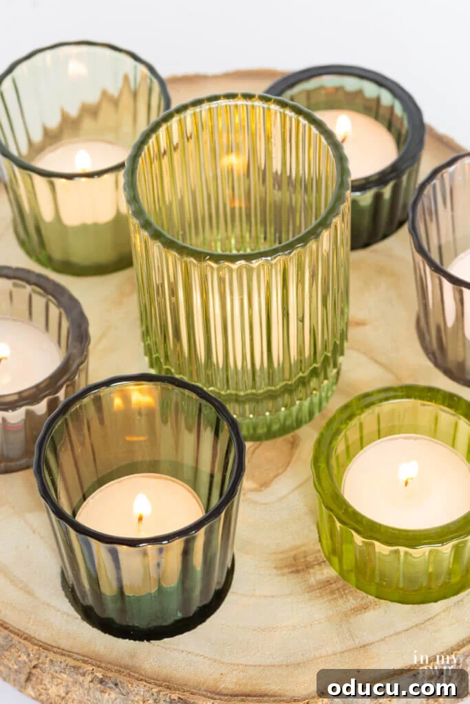 Woodland Inspired DIY Tealight Holders 6 Above view shot of rustic wood slice candle holder with green glass ribbed votive holders.