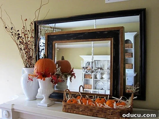 Cozy Autumn Vases: Effortless Ideas for a Warm Home 16 Fall flowers and branches in a white urn on a mantel. decorated for autumn.