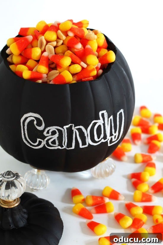 Cozy Autumn Vases: Effortless Ideas for a Warm Home 19 DIy Foam pumpkin candy jar that can also do double-duty as a fall flower vase for a table.