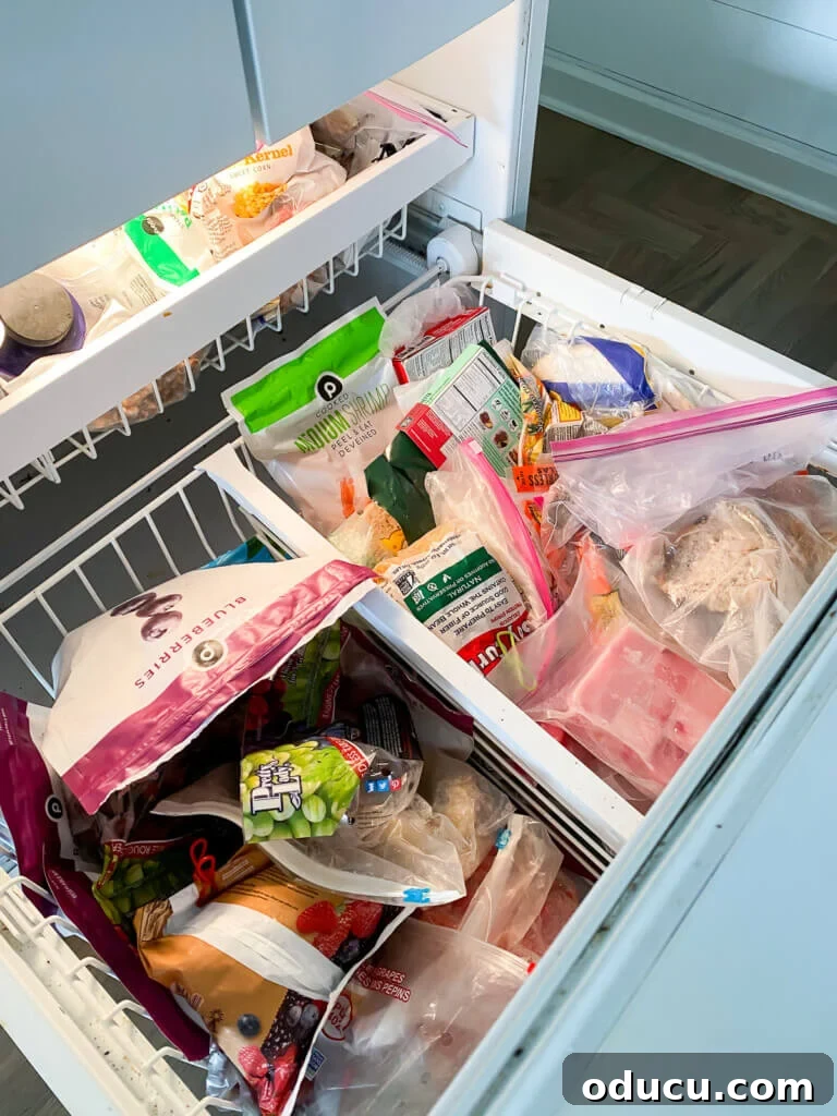 DIY Freezer Drawer Organization Hacks 3 bottom drawer of a freezer before getting organized.