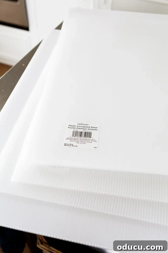 DIY Freezer Drawer Organization Hacks 5 3 white corrugated sheets on a worktable.