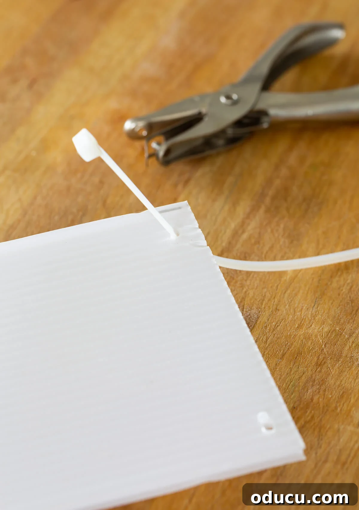 DIY Freezer Drawer Organization Hacks 10 How to attach a zip tie to plastic corrugated sheet to make freezer drawer dividers.