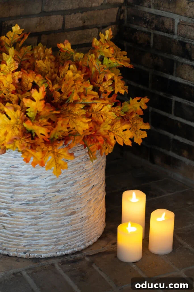 Cozy Fall Living Room on a Dime 12 Cozy home interiors - basket in a fireplace filled with maple leaves.