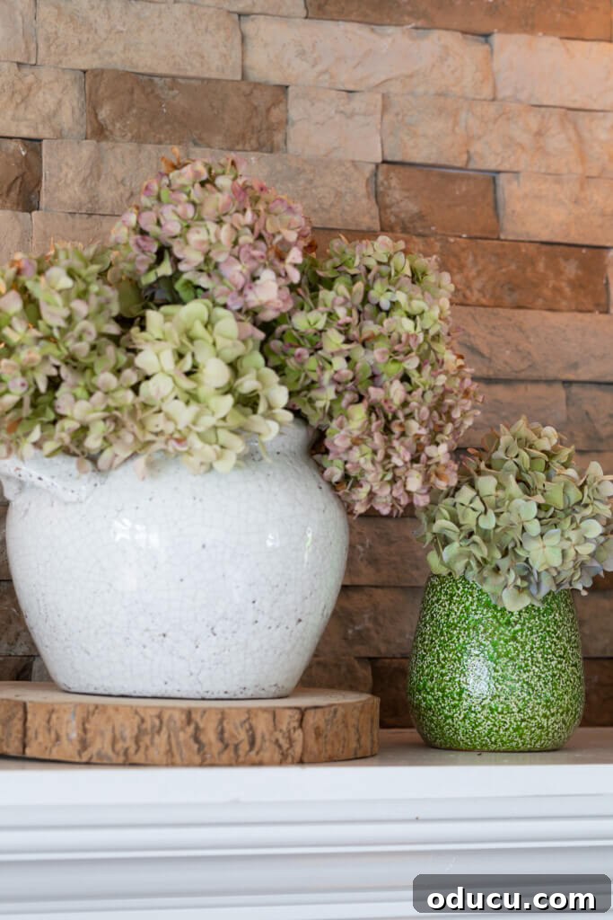 Cozy Fall Living Room on a Dime 3 Dried hydrangeas in planters on a fireplace mantel.