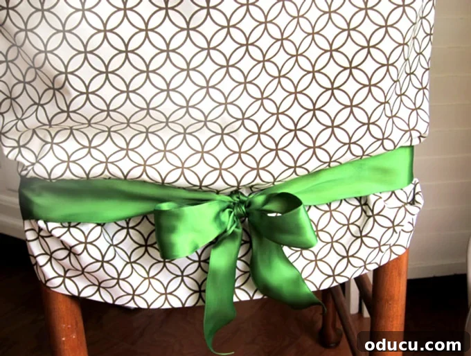 Pillowcase Chair Cover Hack: No Sewing Required! 10 dining-room chair covered with a pillowcse