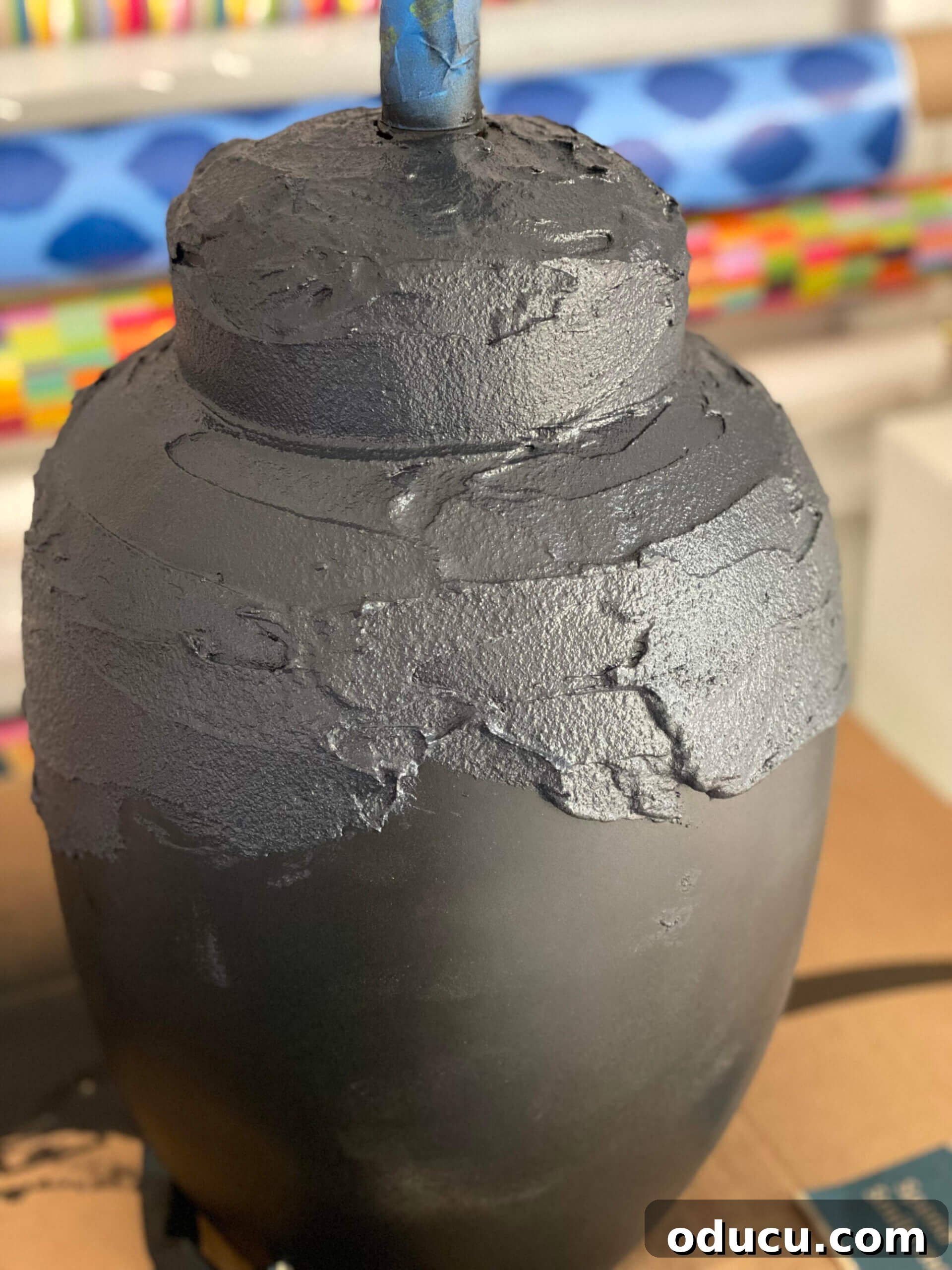 Craft Stunning Table Lamps for Less 8 Textured paint being added to a table lamp base.