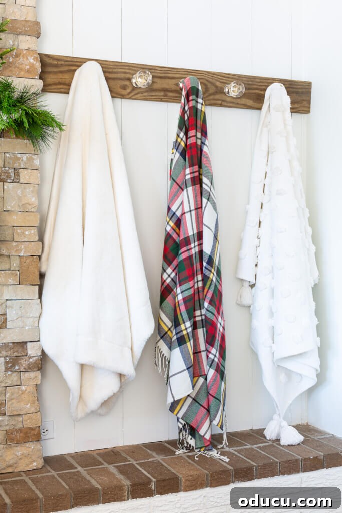 Elegant Wall Organizer for Living Room Throws 4 how to decorate with throw blankets. Use a wall mounted blanket holder in a living room.