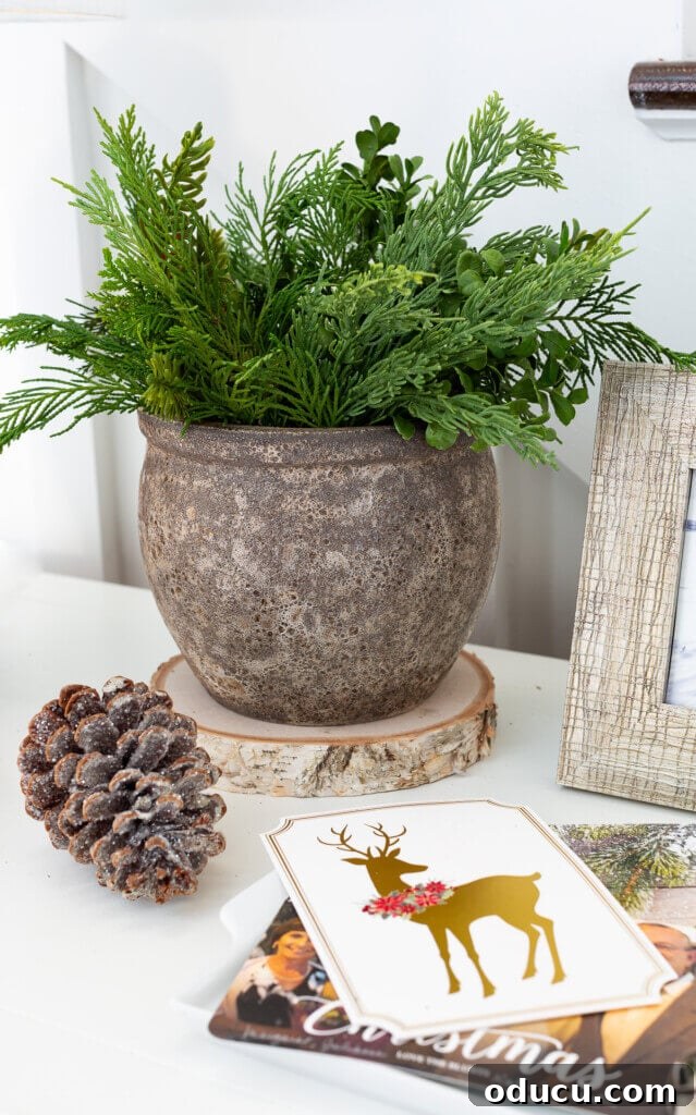 Festive Without the Fuss: Our Christmas Home Tour 14 A charming vignette of natural-toned Christmas decorations, showcasing the beauty of simplicity and organic materials.