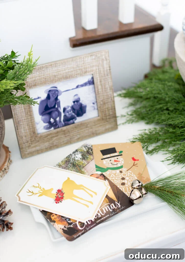 Festive Without the Fuss: Our Christmas Home Tour 15 Christmas cards neatly arranged on a tray on a console table, demonstrating how received greetings can become part of the decor.