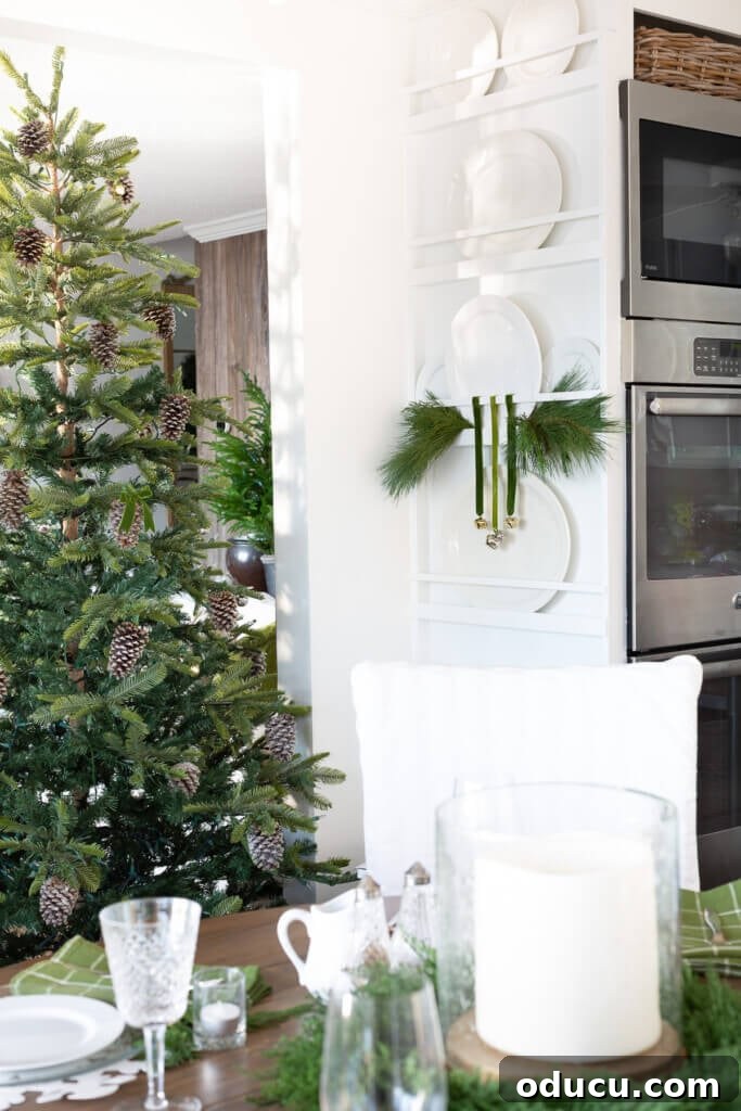 Festive Without the Fuss: Our Christmas Home Tour 17 A charming kitchen plate rack, elegantly decorated for Christmas with natural elements and festive accents.