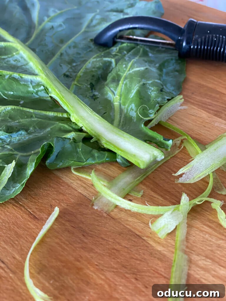 Effortless Vegan Collard Green Wraps 4 How to make a collard green leaf easy to roll into a wrap sandwich - use a vegetable peeler.