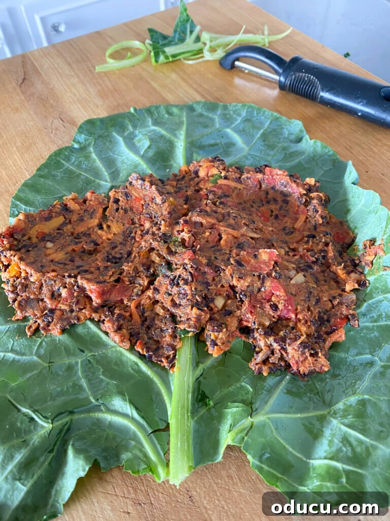 Effortless Vegan Collard Green Wraps 5 collard green wrap being made using a vegan filling