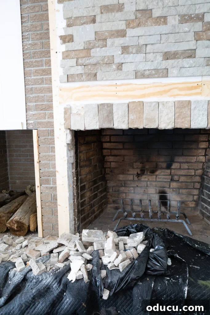 Tearing Out Your Stone Fireplace 2 Fireplace stone surround being carefully removed due to safety concerns