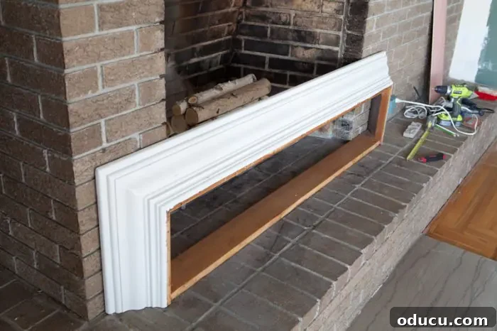 Tearing Out Your Stone Fireplace 7 Top molding of a dining room hutch repurposed into a fireplace mantel