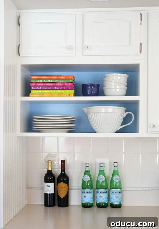 Open Kitchen Shelving: Cabinet Door Removal 13 Open shelves in kitchen with removable backdrops of color.