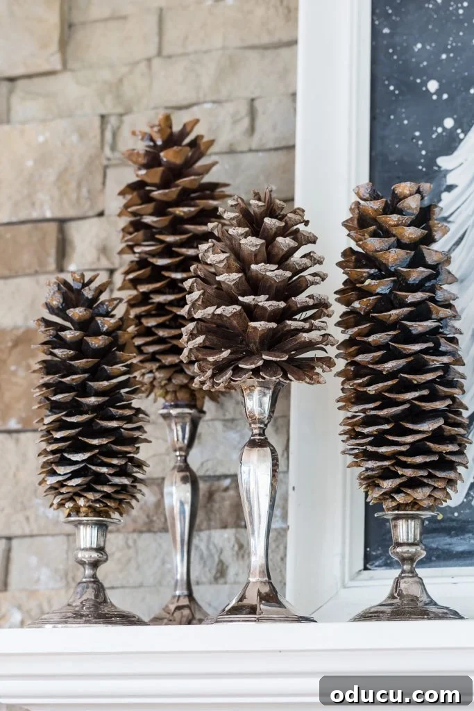 Unlock New Decor Ideas for Candle Holders 12 Elegant pine cones arranged on classic silver candlesticks, creating a sophisticated and natural holiday display.
