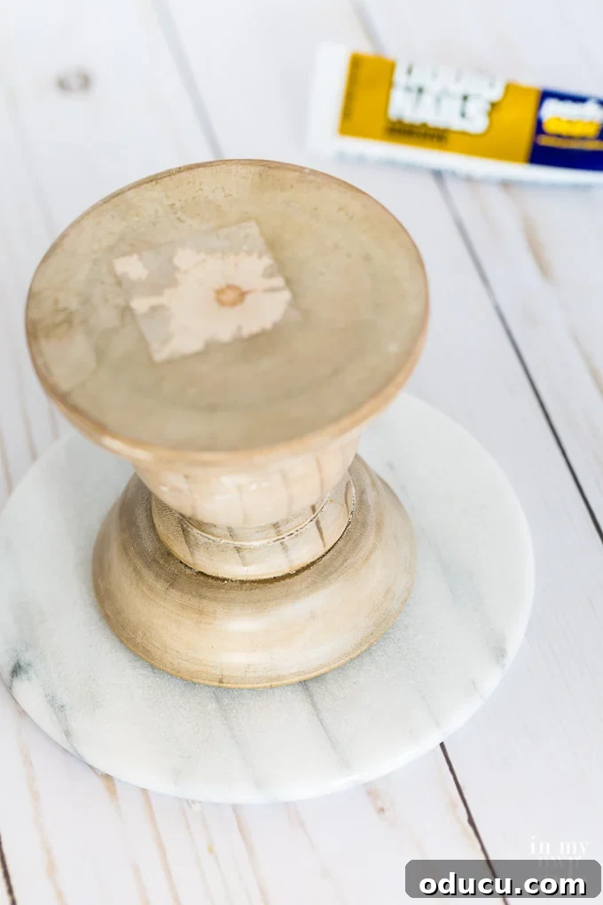 Unlock New Decor Ideas for Candle Holders 14 Carefully gluing a wood pedestal to a round marble top for a robust and elegant stand.