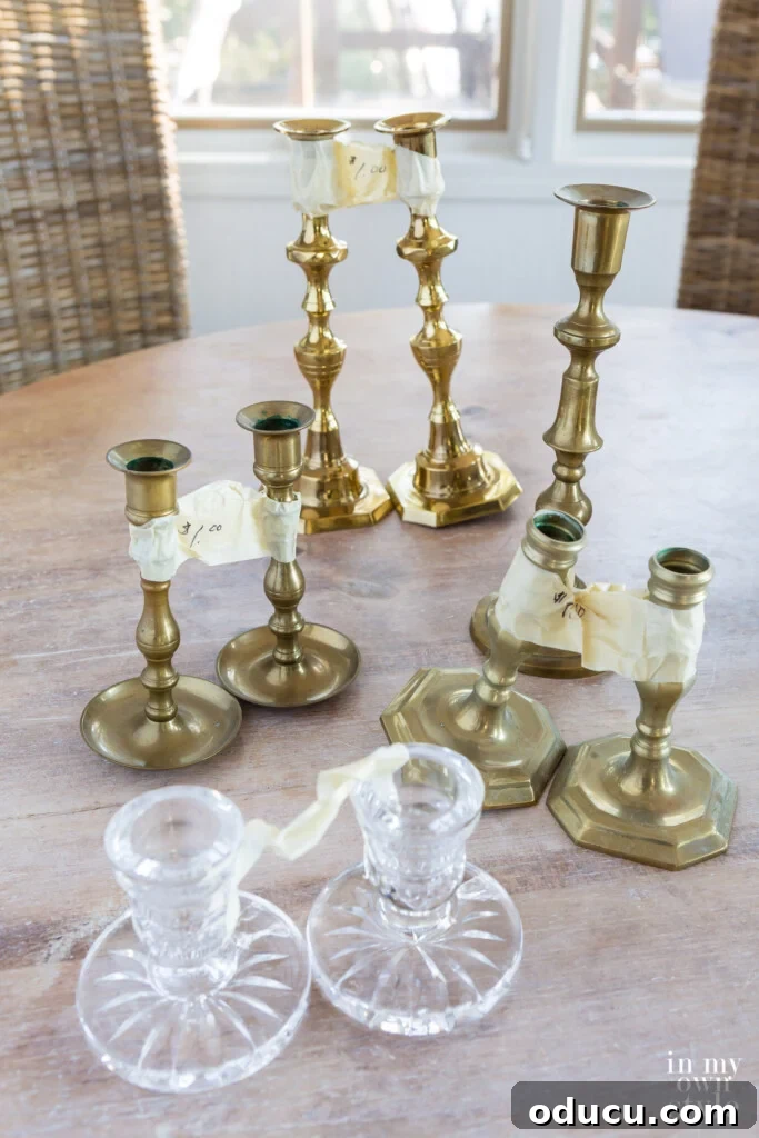 Unlock New Decor Ideas for Candle Holders 17 A collection of used brass taper candle holders, thrifted from a church sale, showing their raw potential.