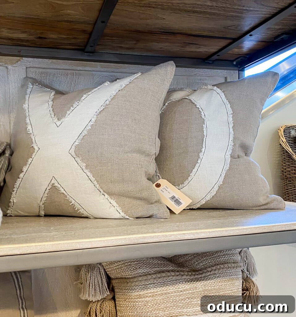 Craft Personalized XO Applique Pillows 2 Chic XO pillows adorning a sofa, ready to be a stylish addition to any home decor.