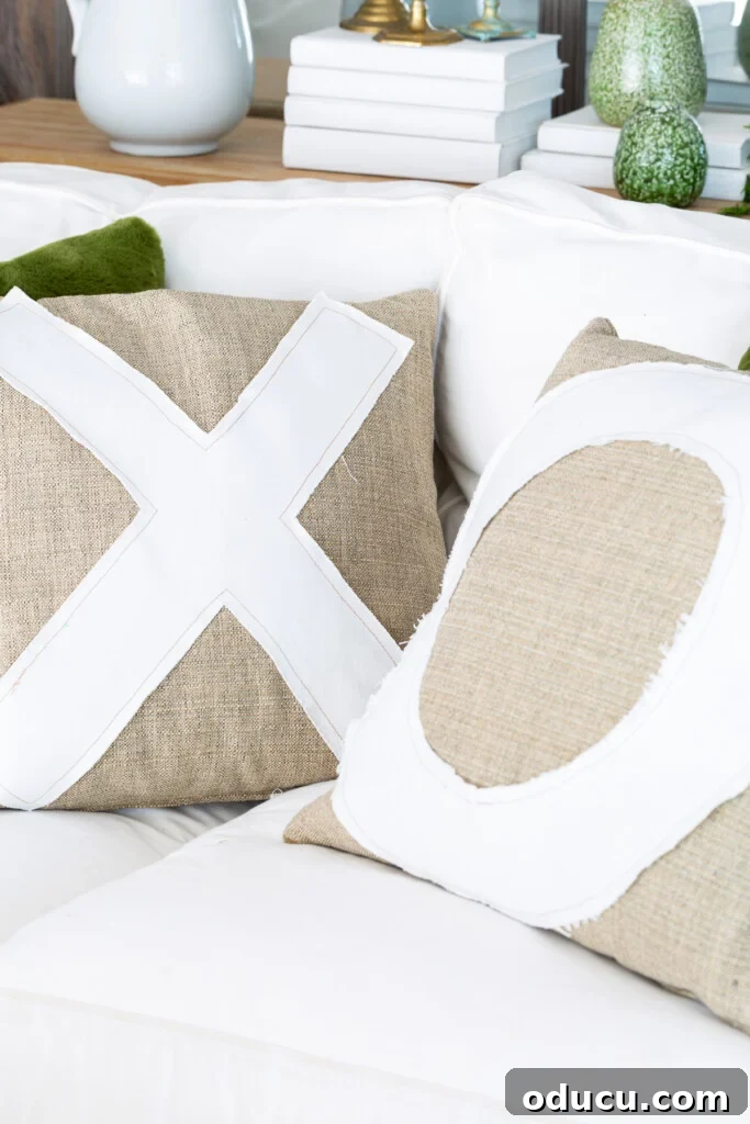 Craft Personalized XO Applique Pillows 6 A pair of charming X and O throw pillows nestled on a crisp white sofa, radiating warmth and style.