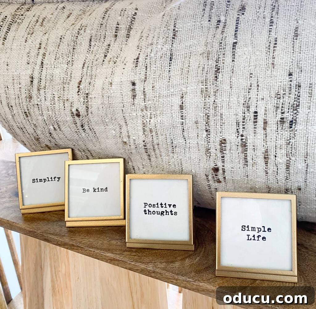 10 Easy DIY Decor Projects to Achieve a Designer Look for Less 3 small gold frames lined up on a shelf with sayings written on them