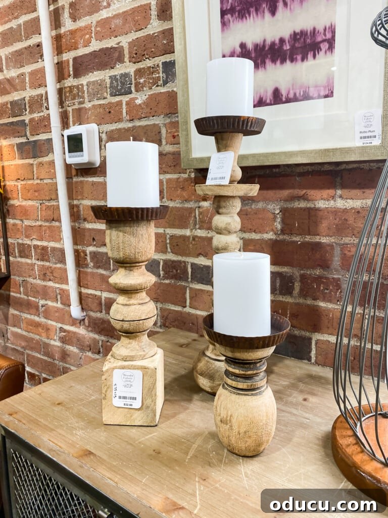10 Easy DIY Decor Projects to Achieve a Designer Look for Less 9 knock-off wood turned wood post pillar candle holders on a table.