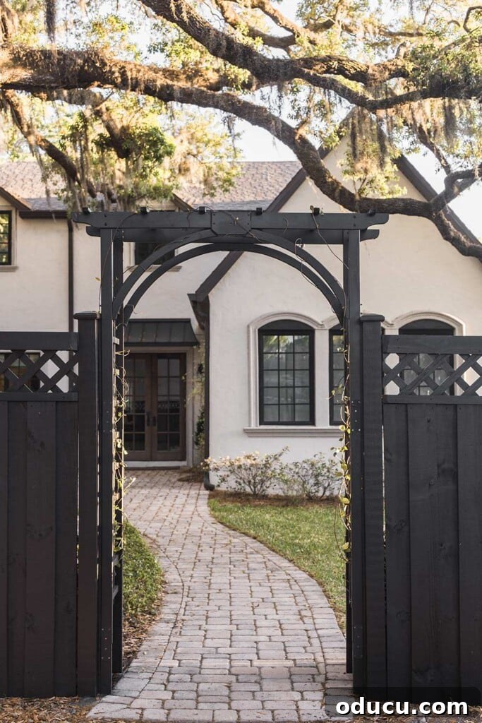 Chic Chronicles 85 2 Elegant black arbor from Jenna Sue Design, enhancing garden aesthetics.