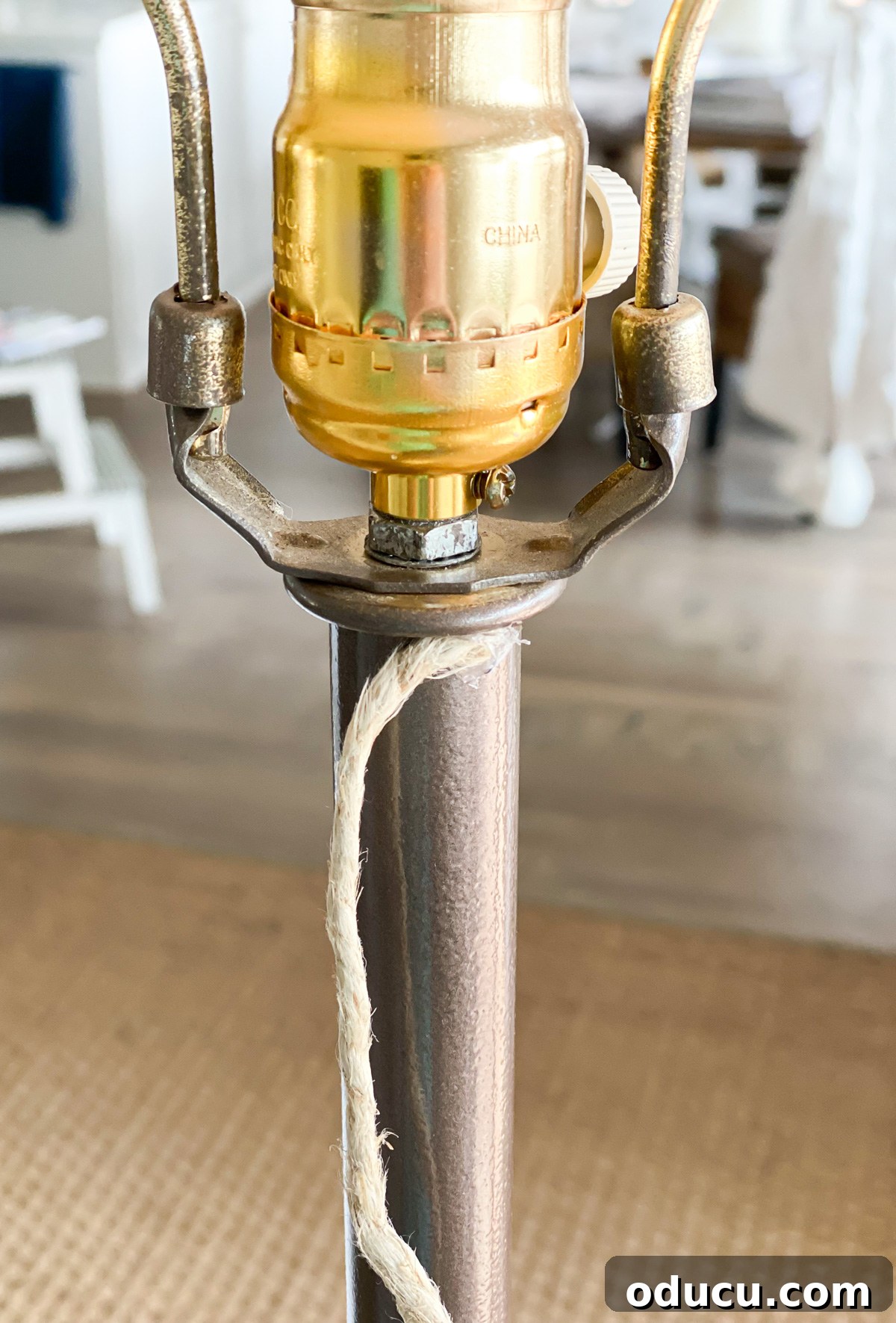 Stunning Floor Lamp Makeover for Less Than Ten Bucks 5 how to start wrapping hemp cord around base of floor lamp to give it a DIY coastal decor makeover