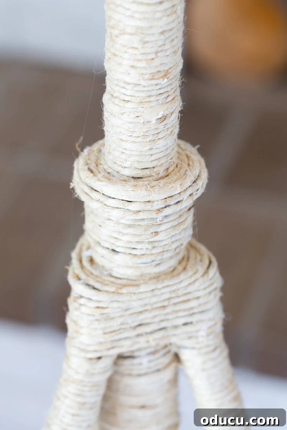 Stunning Floor Lamp Makeover for Less Than Ten Bucks 9 close up of junction area where base meets legs and how to wrap with the hemp cord.
