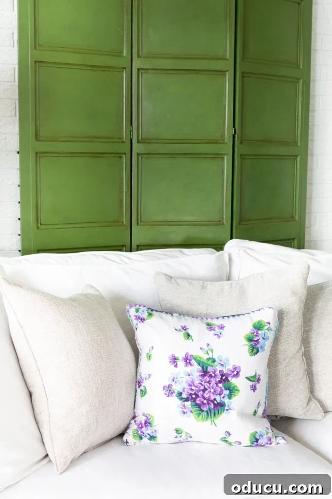 Effortless Glaze Finishes for Furniture 3 Antique Furniture With Glaze - decorative wood screen painted and glazed green. Behind a sofa.