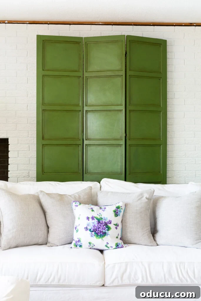 Effortless Glaze Finishes for Furniture 5 green Furniture Glaze on a decorative screen on white brick