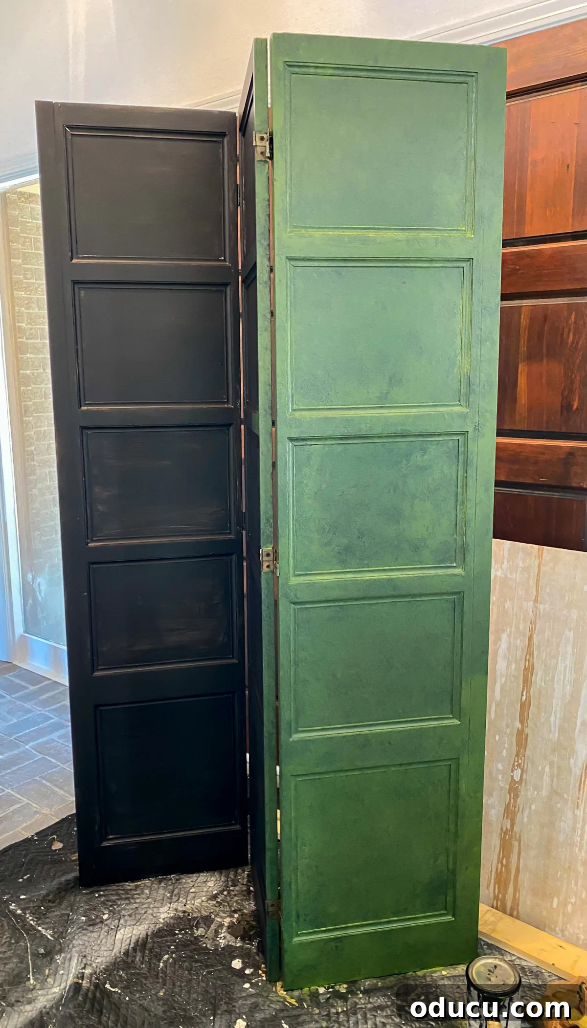 Effortless Glaze Finishes for Furniture 9 First coat of green paint and glaze mixture added to a decorative wood screen that has a black paint primer on it.