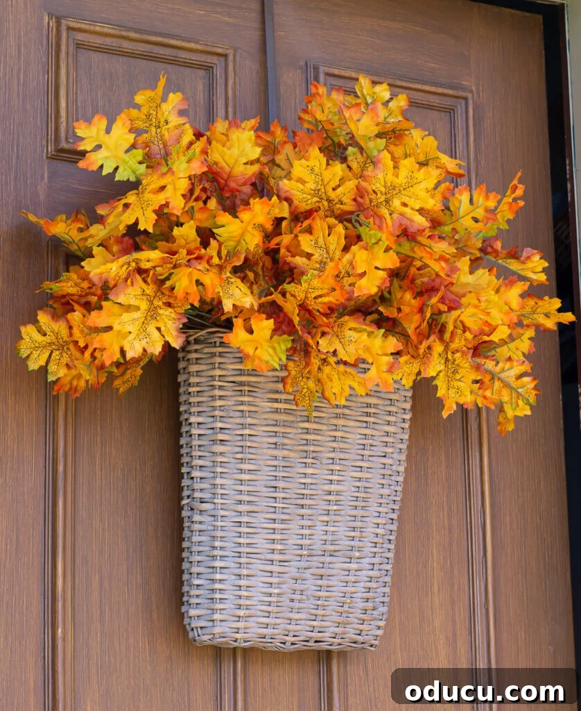 Cozy Fall Wicker Door Basket Project 2 flat sided hanging basket on door filled with leaves for fall decoration.