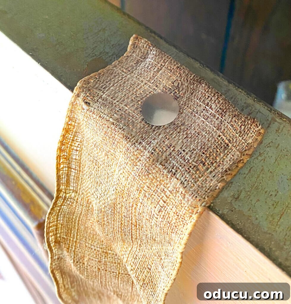 Cozy Fall Wicker Door Basket Project 12 ribbon tacked to top of exterior door to be used to hang wreaths and baskets on a door for fall.
