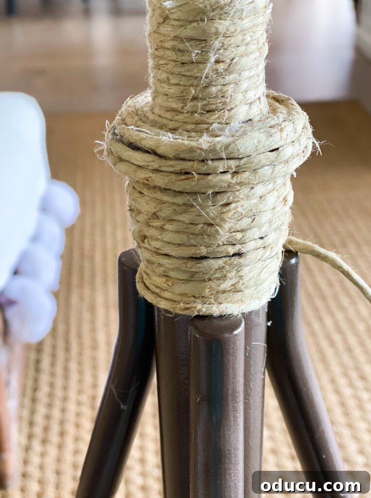 12 Affordable DIY Summer Decor Projects 12 The process of wrapping twine around a tripod-style floor lamp to give it a fresh, summery, and coastal-inspired look.