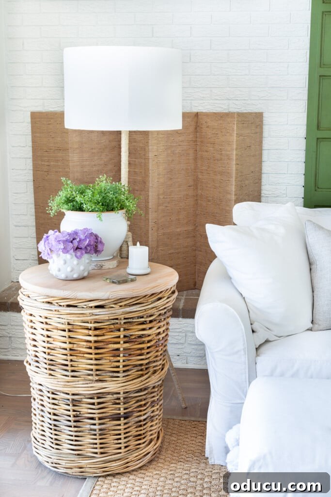 12 Affordable DIY Summer Decor Projects 13 A cozy corner of an easy-breezy living room, thoughtfully decorated for the summer season with light and natural elements.