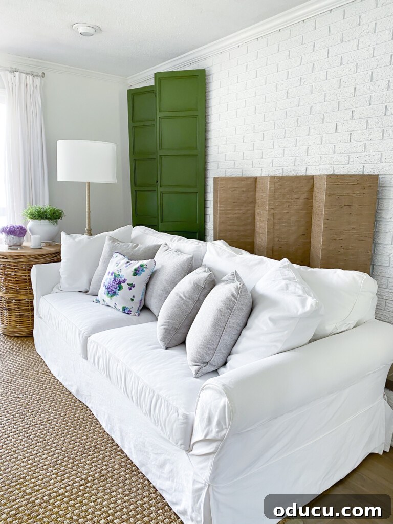 12 Affordable DIY Summer Decor Projects 14 A beautifully decorated living room fireplace wall for summer, showcasing thoughtful seasonal accents and design.