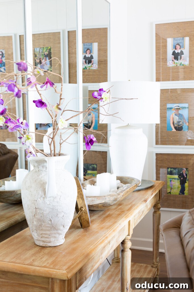 12 Affordable DIY Summer Decor Projects 23 Living room walls adorned with tasteful decor for the summer season, featuring bright accents and a serene atmosphere.