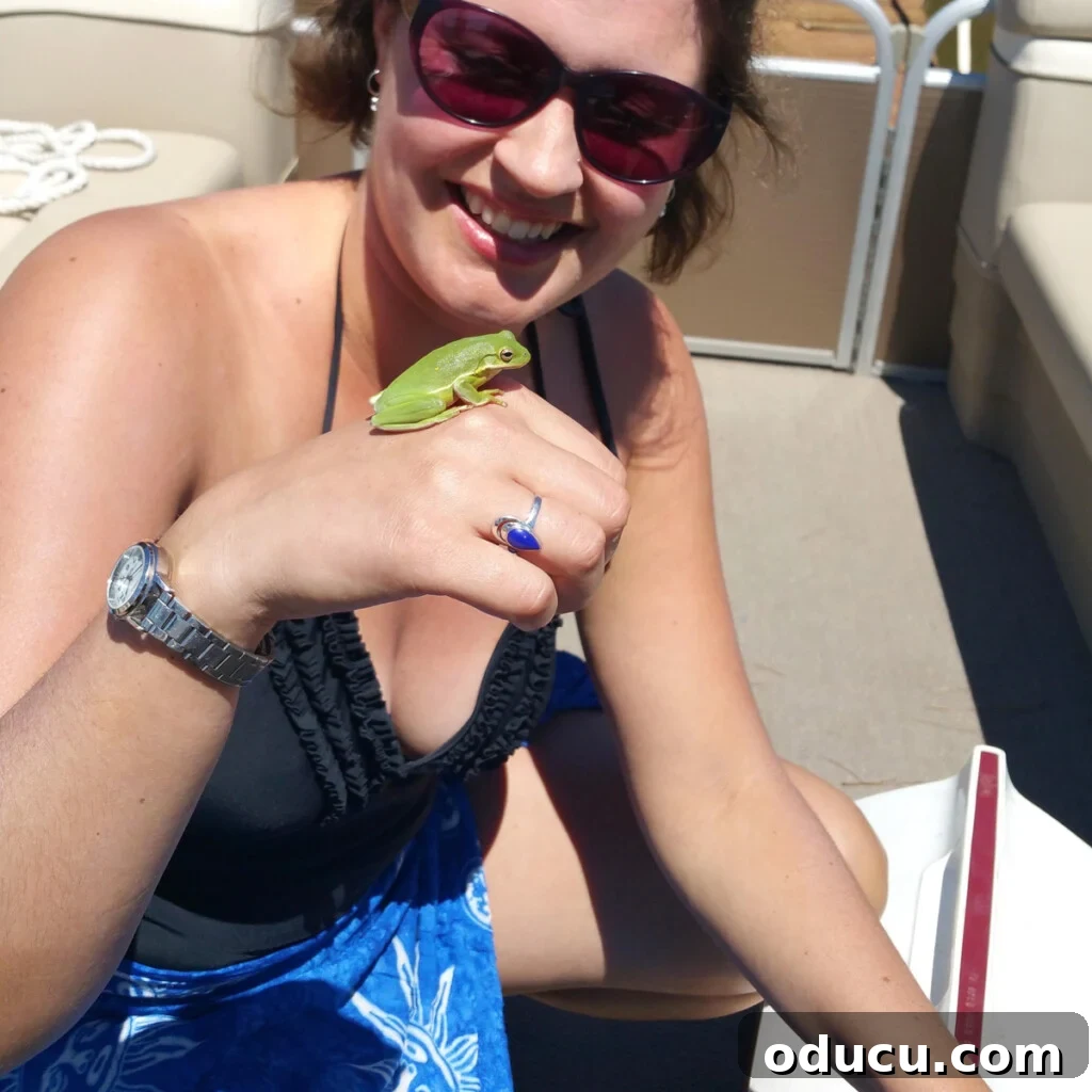 Make a Statement with Large Outdoor Clocks 5 girl holding a green frog found outside
