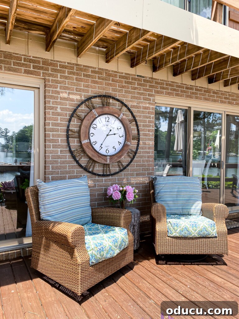 Make a Statement with Large Outdoor Clocks 6 Woven deck chairs on deck with large wall clock on wall behind the chairs.