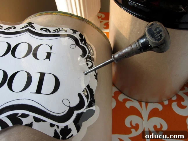 Create Your Own Pet Food Storage System 11 Making holes in the side of the can for DIY Pet Food Containers
