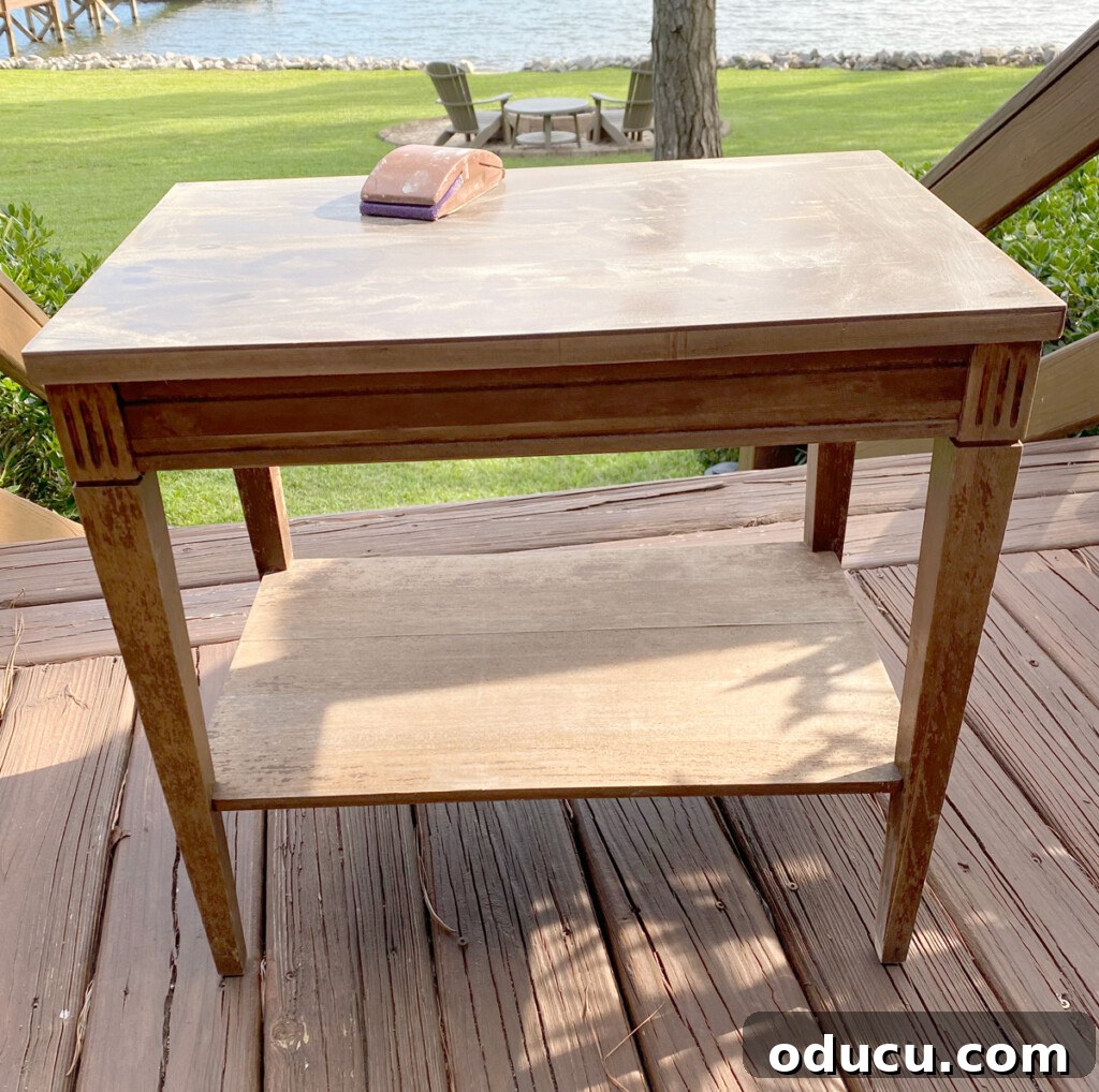 Designer Dupe Two-Tier End Table Makeover 2 Old, worn two-tier thrift store end table before its makeover, showing signs of wear and tear with a laminate top.