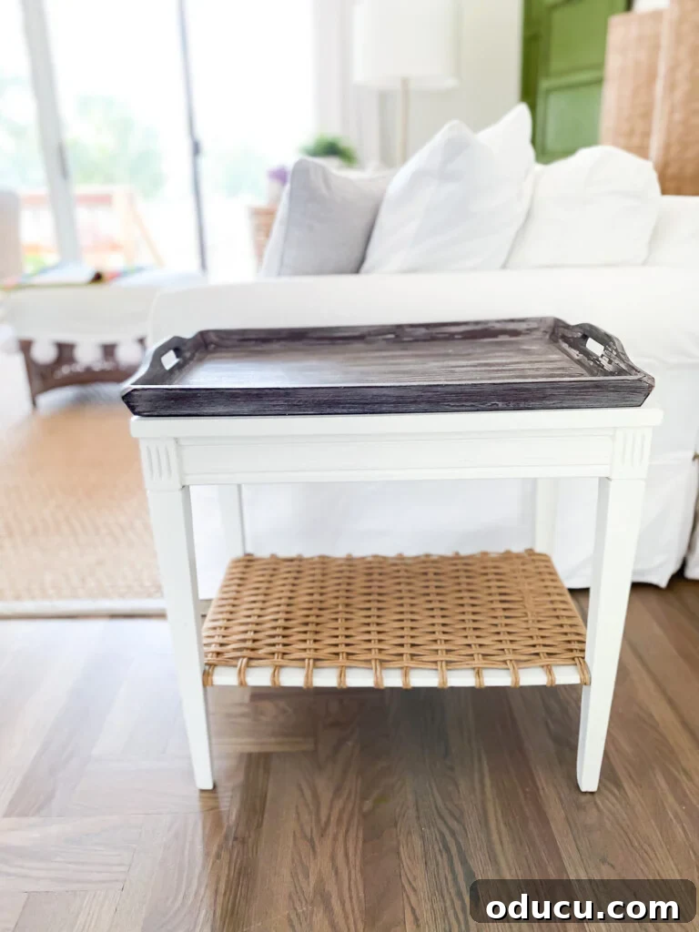 Designer Dupe Two-Tier End Table Makeover 12 Dark wood tray contrasting against the white painted DIY end table makeover, suggesting a cozy, autumnal or traditional styling option.