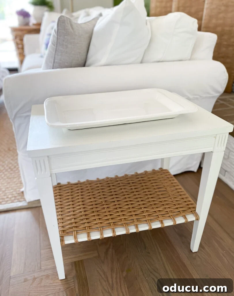 Designer Dupe Two-Tier End Table Makeover 10 Minimalist white ceramic platter positioned on the two-tier end table makeover, demonstrating a clean and modern decor option.