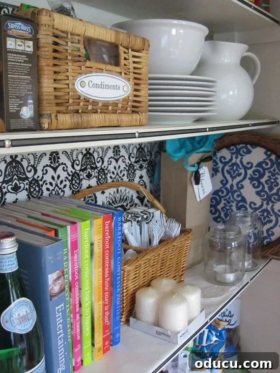 From Coat Closet Chaos to Organized Pantry Perfection 16 Ribbon trimmed shelf edges in a pantry AFTER