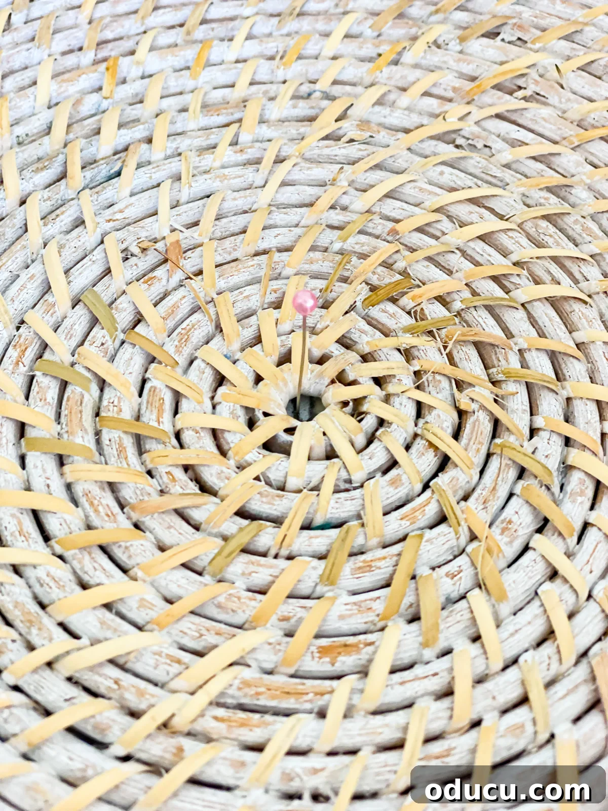 Reinvent Your Bar Stool as a Chic Accent Table 13 close up of center of wicker tray and a pin used to center it on stool, showing precise alignment.
