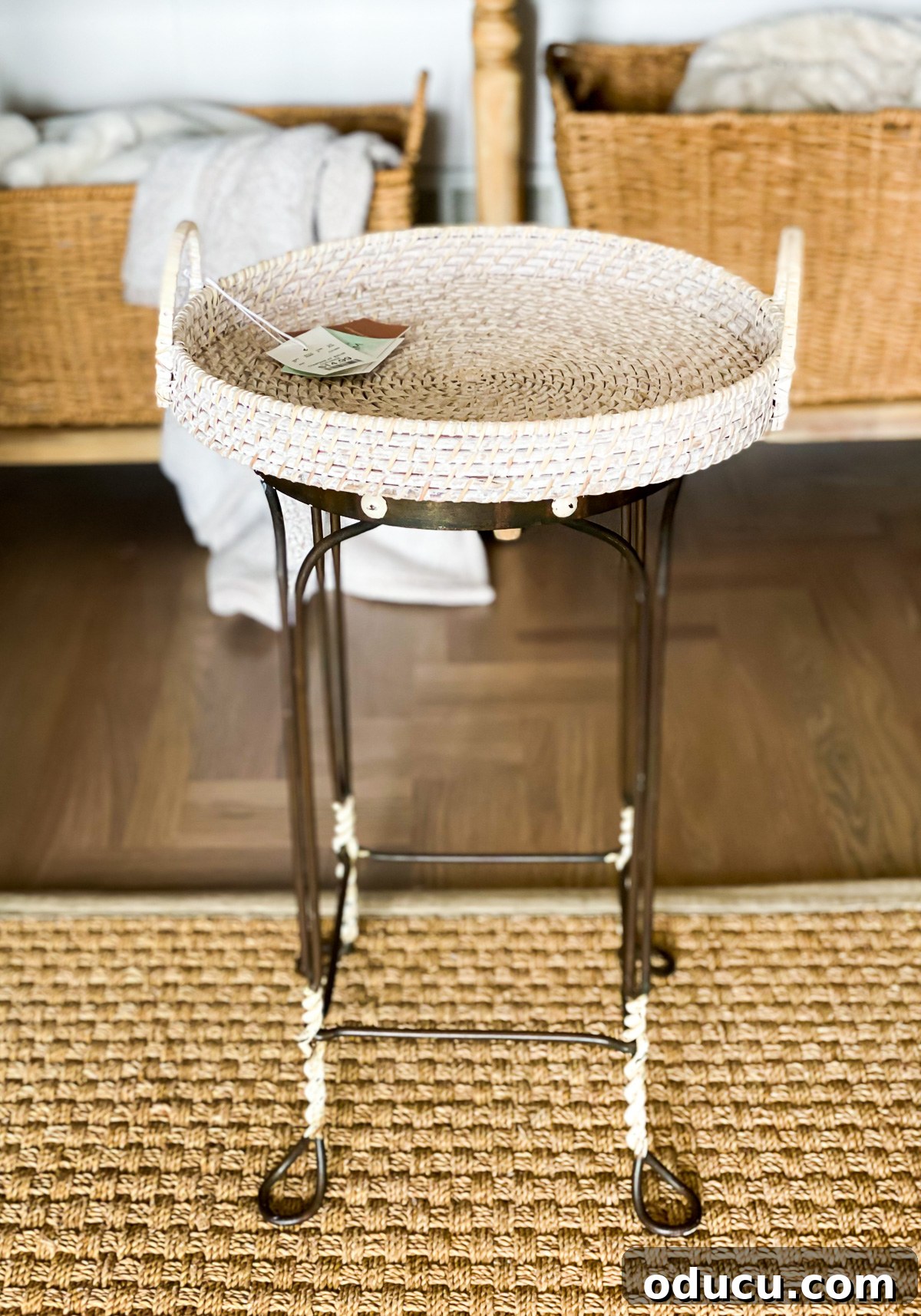 Reinvent Your Bar Stool as a Chic Accent Table 10 DIY side table made using a vintage metal stool and a round wicker tray, ready for assembly.