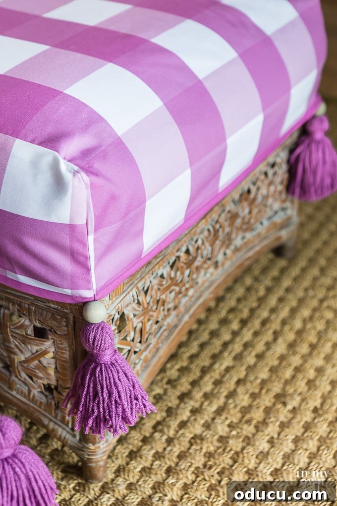 Embracing Autumn Hues in Your Living Space 14 Purple and white buffalo check ottoman slipcover with a handmade yarn tassel, adding a pop of color and rustic texture to the living room.